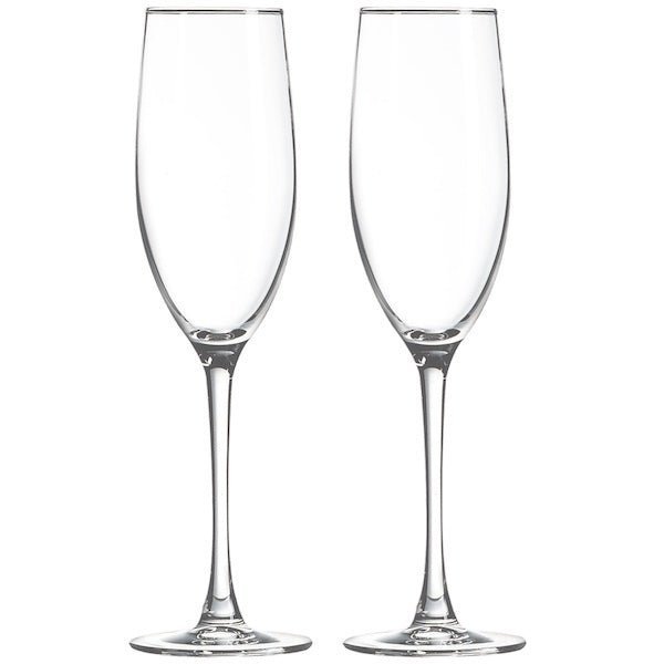 Two clear champagne flutes with slender stems