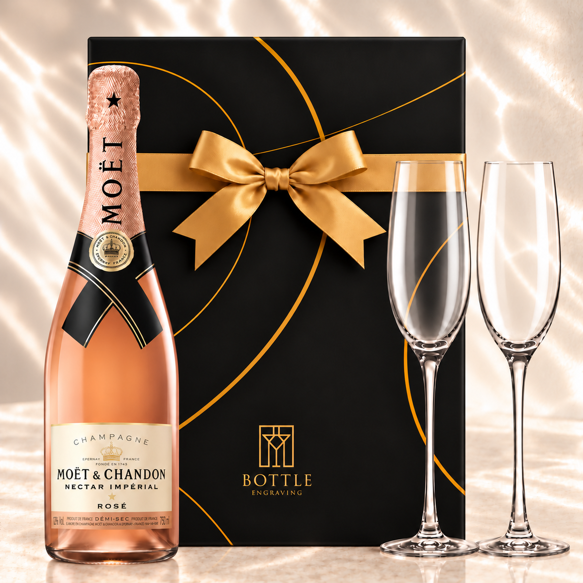 Moët & Chandon Nectar Impérial Rosé Champagne gift set with two champagne flutes and a black Bottle Engraving gift box with a gold bow.